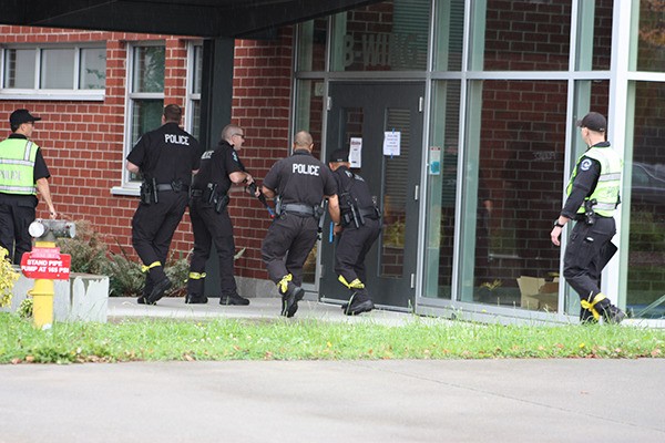 Redmond police prepares to enter Redmond High School during an active shooter drill.