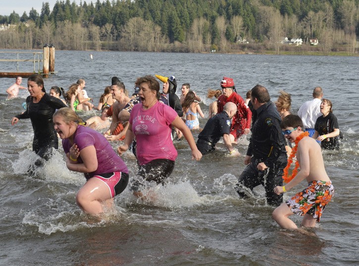 More than 80 people ran into the 45-degree water in support of Special Olympics Washington. Participants raised $11