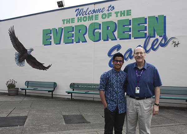 Evergreen Middle School student Moiz Chawdhary and health teacher Paul Blair