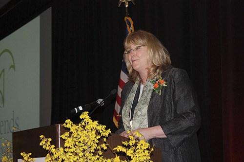 Terry Pottmeyer speaks at a Friends of Youth fundraising luncheon in Bellevue in 2013.