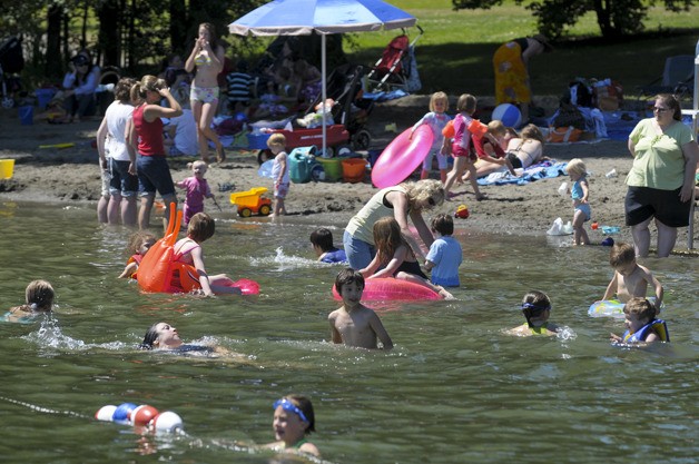 The hot weather makes Idylwood Beach Park in Redmond a popular place. Make sure to take safety precautions when playing in the water.