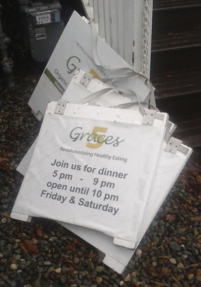 Graces 5 sidewalk signs lean against a post outside of the restaurant at 8110 164th Ave. N.E. in Redmond. The health-conscious eatery closed last week after losing its business license due to unpaid taxes.