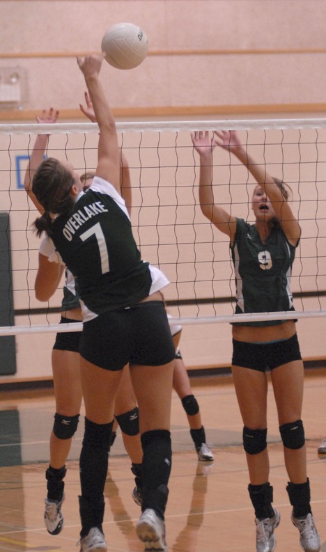 Overlake outside hitter Claire Bazley goes up for a spike as Bear Creek sophomore Elizabeth Fernandez defends during the Owls-Grizzlies volleyball matchup on Monday night at The Overlake School. The Owls swept the Grizzlies 3-0.