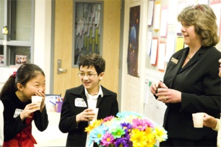 Redmond Elementary students Lilly Cao and Anuj Maniyar enjoy some light-hearted conversation with Redmond Councilmember Kim Allen. Redmond Mayor John Marchione