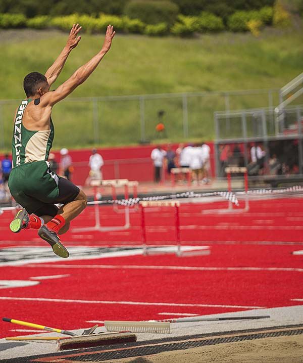 Bear Creek's Jonny Magee tackles the long jump at state.