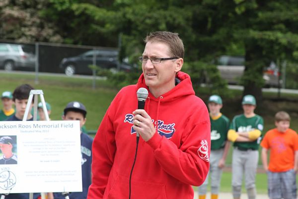Dr. Bryan Roos addresses more than 160 area Little League players and their families at the inaugural Jackson Roos Memorial Weekend Tournament at Hartman Park in Redmond on May 25. The tournament