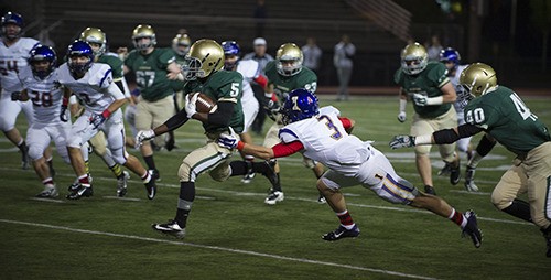 Redmond's Gerald Wright breaks off a run during Friday night's game against Issaquah.