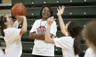 Three-time WNBA MVP Sheryl Swoopes watches students play during the First Annual Sheryl Swoopes Basketball Clinic at The Overlake School earlier this week.