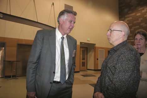 Candidate Larry Phillips talks with North Bend resident Stephen Kangas at Thursday's King County Executive Forum held on Thursday