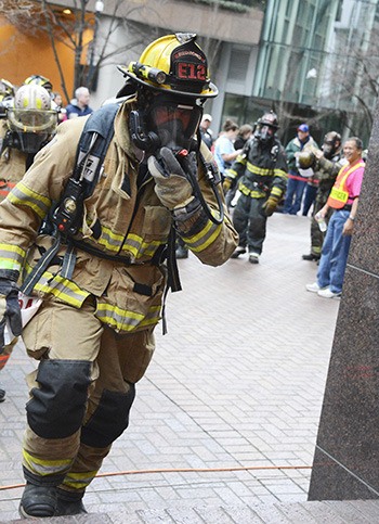 Redmond Fire Department's John Simon prepares to climb the Seattle Columbia Tower stairs at Sunday's Firefighter Stairclimb to benefit the Leukemia and Lymphoma Society. Wearing full equipment