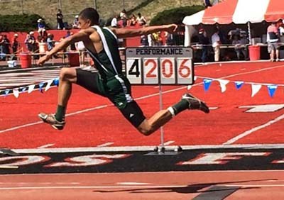 Bear Creek's Jonny Magee competes in the triple jump at state. His winning jump was 45 feet. (The posted score is the previous competitor's mark.)