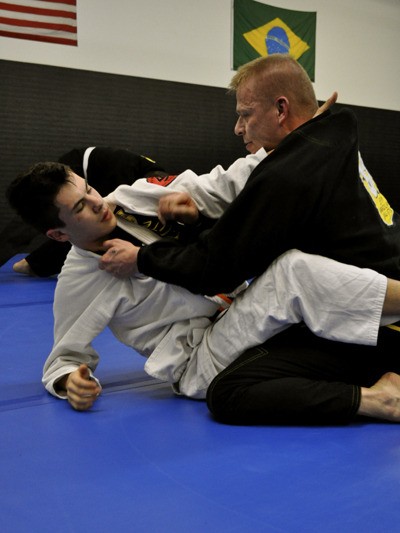 An Elite Brazilian Jui-Jitsu student and Mika Elo spar during a class at the new Elite campus in Redmond. Mika