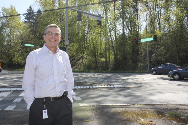 Public works Director Bill Campbell stands at the traffic light intersection of West Lake Sammamish Parkway and Bel-Red Road