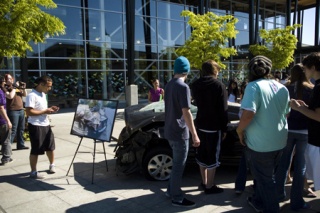 Redmond High students gathering around a demolished car from a drunk driving accident.
