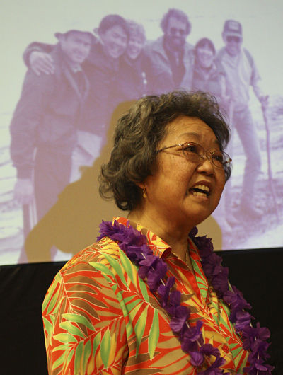 Ann Cohen speaks with attendees at the celebration of life gathering on Wednesday night for her brother