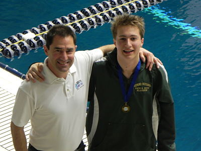 Eric Klassen sports his first-place medal alongside diving coach Skip Hulet.