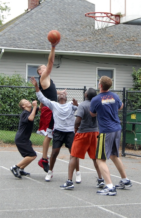 Paul Richards of the Redmond Fire Department goes up for a shot during last Saturday's 'Hoops for Food' 3-on-3 basketball tournament at the Old Fire House Teen Center. The event raised over 200 cans of food for Hopelink. Six teams