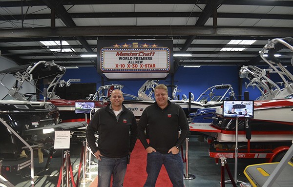 MasterCraft Northwest/Seattle General Manager Kevin Grant (left) poses with sale associate Richard Purchas in the new MasterCraft showroom.