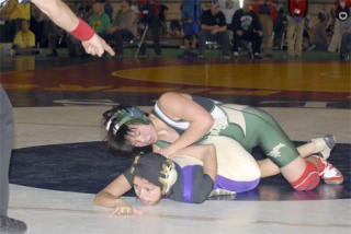 Redmond’s Catherine Kelly puts the clamp down on Connell’s Lupita Mendez. Kelly won the match