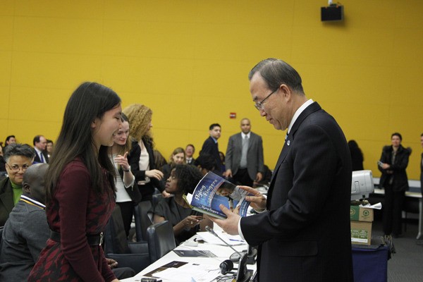 Redmond High School junior Adora Svitak shares her book with United Nations Secretary General Ban Ki-Moon.
