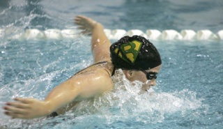 Senior Maureen Cardwell swims the butterfly leg of the 200-yard medley relay during Saturday’s district swim meet at Juanita High. The Mustangs’ relay team won in dominating fashion with an All-American consideration time of 1:49.68.