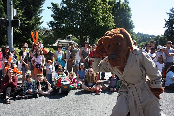 McGruff the Crime Dog encourages the crowd to make some noise during the Grand Parade at Derby Days on Saturday.
