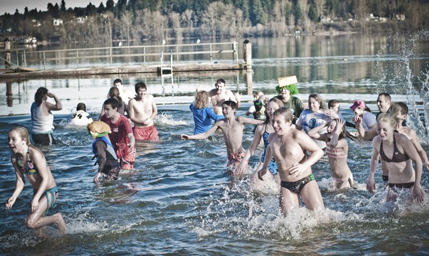 Nearly 30 people ran into the frigid waters of Lake Sammamish New Year's Day to help raise money for the Special Olympics Washington as part of the Fifth Annual Redmond Polar Plunge