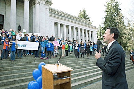 Sen. Andy Hill (R-Redmond) stands on the Capitol steps and talks with families who visited Olympia on Jan. 19 to advocate for education funding.