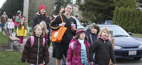 Horace Mann Elementary School in Redmond started its Walking School Bus program Wednesday morning. Six teams with 20 to 35 passengers each from different neighborhoods participated. The program was created to encourage people to walk more as well as to lessen car emissions in the community. From left: Catherine Smalling