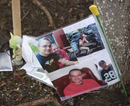 Friends in Redmond started an informal memorial for Redmond resident Ben May on a fence in the parking lot of Perrigo Community Park