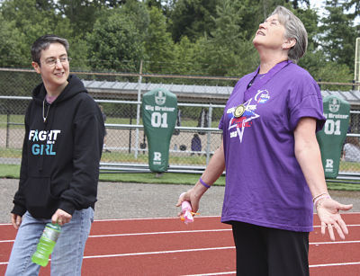Kathy Kubista (right) gets animated while telling friend Aimee Kohn a story while participating in last summer’s Relay For Life at Redmond High.