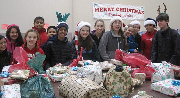 Stella Schola students recently volunteered with the Forgotten Children's Fund Christmas to wrap presents for families in need.
