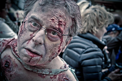 A zombie walks through the crowd during last Saturday's 'Thrill the World' event at Redmond Town Center.