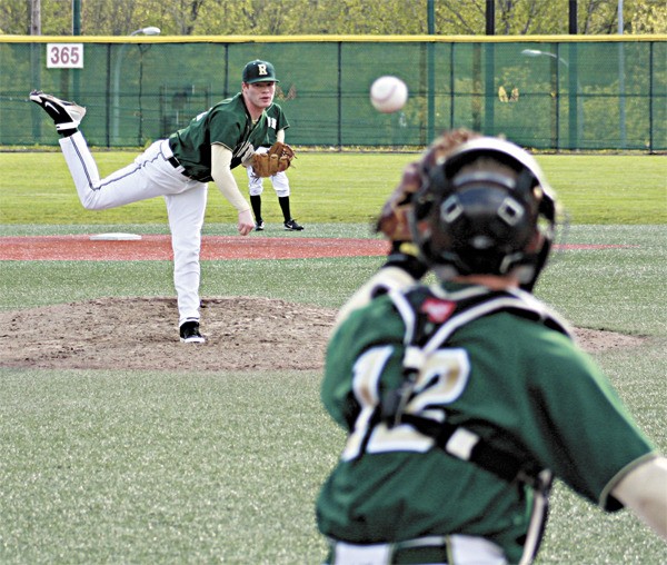 Redmond starter Zach Abbruzza serves up a pitch during Tuesday's 3-2 loss to Newport at Newport High School. The Knights' win enabled them to take the No. 1 seed from the Crest Division into the Kingco Tournament