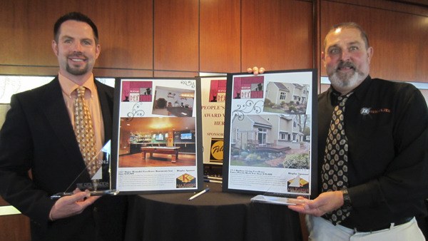Tenhulzen Remodeling project managers Rob Pitre (left) and Brett Wamboldt show off their projects that recently won top honors at the 2012 REX Awards.