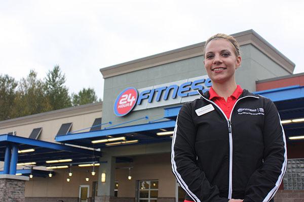 Fitness manager Christy Wondercheck stands in front of the soon-to-be open 24 Hour Fitness center in the old Top Foods building. The business will be open on Oct. 12.