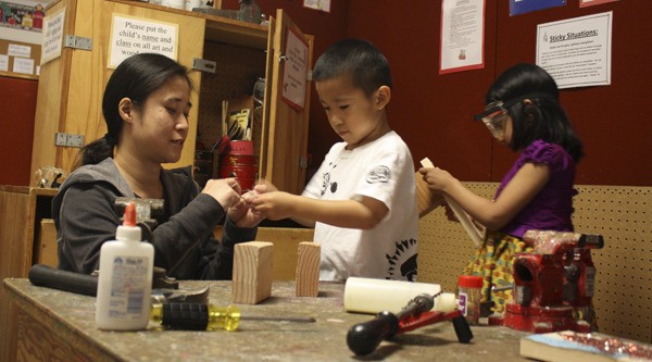 Eileen Chinn (left) does woodwork with her son Connor Chinn and Gayatri Teegavarapu at the Redmond Parent Cooperative Preschool. The school is part of the Lake Washington Technical College (LWTC) Parenting Education program. Due to state budget cuts