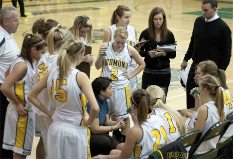First-year Mustangs' head coach Sara Goldie talks to her players during a timeout against Newport last Friday. Goldie
