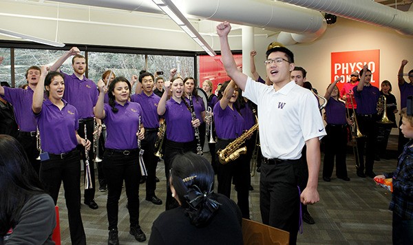 Members of the University of Washington marching band help celebrate the 60th anniversary of Redmond-based Physio-Control. The company began in Seattle and opened its corporate headquarters in Redmond in 1974.