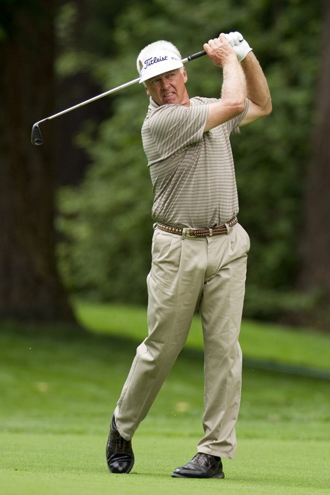 Bruce Vaughn watches his approach shot on the sixth hole of the first round at the 2010 U.S. Senior Open Championship at Sahalee Country Club in Sammamish