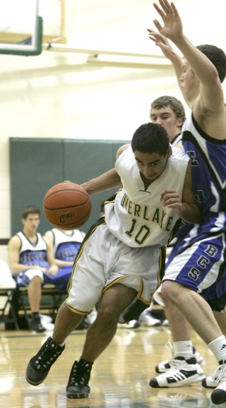 Overlake junior guard Hakan Yagiz drives to the basket during Tuesday's 68-54 loss to Bellevue Christian. Yagiz scored a team-high 12 points.