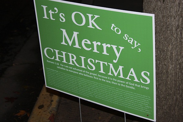 Someone posted Christmas signs around downtown Redmond starting late Saturday. Here's one near the downtown Redmond library.