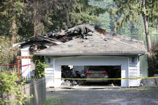 A faulty lamp caused a fast-moving fire that engulfed and destroyed the home of Eighth Congressional District candidate Darcy Burner. The charred home is located between Redmond and Carnation along the shore of Ames Lake.