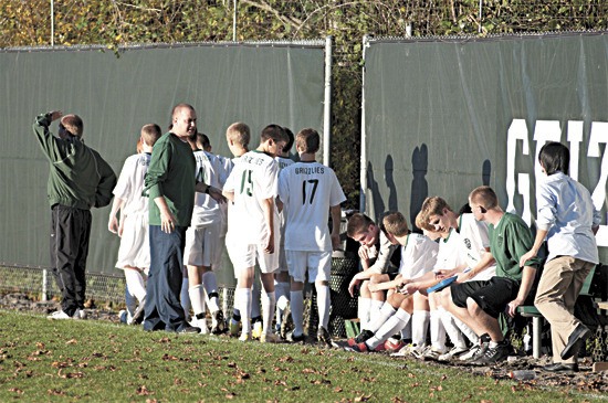 Bear Creek boys' soccer head coach Chad Pohlman rallies his troops during the second half of a league win over Evergreen Lutheran on Tuesday afternoon at The Bear Creek School. Pohlman's team went undefeated this year at 16-0-0 and will play for the 1B/2B Bi-District title on Saturday night against La Conner at Sammamish High School at 5 p.m.