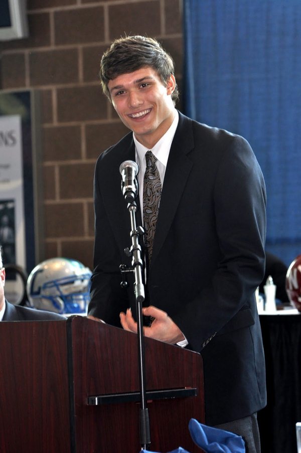 Redmond High senior James Boker speaks to the crowd after earning the  National Football Foundation's Scholar Athlete Award for the 2010 season at Qwest Field. Boker will play in the East-West All-Star game on July 1 at Eastern Washington University in Cheney and plans to walk on to the University of Washington football team this fall.