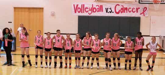 The Overlake School's volleyball team sports pink jerseys at last October's 'Volleyball Vs. Cancer' event