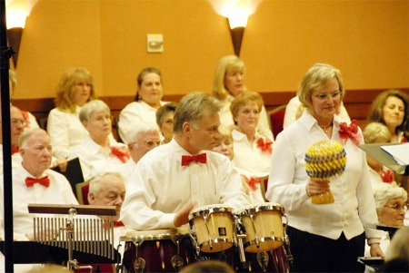 Percussionists John Biagianti (left) and Cindy Potter (right) performed with the Trilogy Singers at a recent concert. The Trilogy Singers