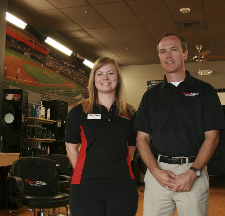 Redmond Sports Clip store manager Erika Denman and owner Rob Crandall said business has been good since the sports-themed