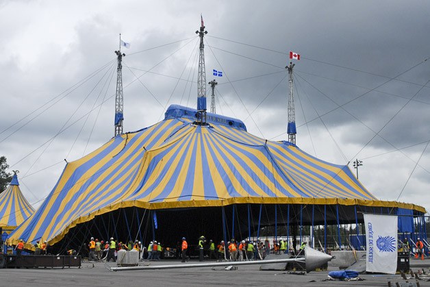 Crews raise the “Grand Chapiteau” (big top tent) Thursday afternoon in preparation for “KOOZA