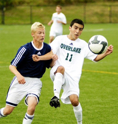 Overlake midfield/forward Rohan Kumar battles for the ball during the Owls' 3-2 season-opening win over Tacoma Baptist on Tuesday. Kumar scored twice during the game to lift the Owls to victory.